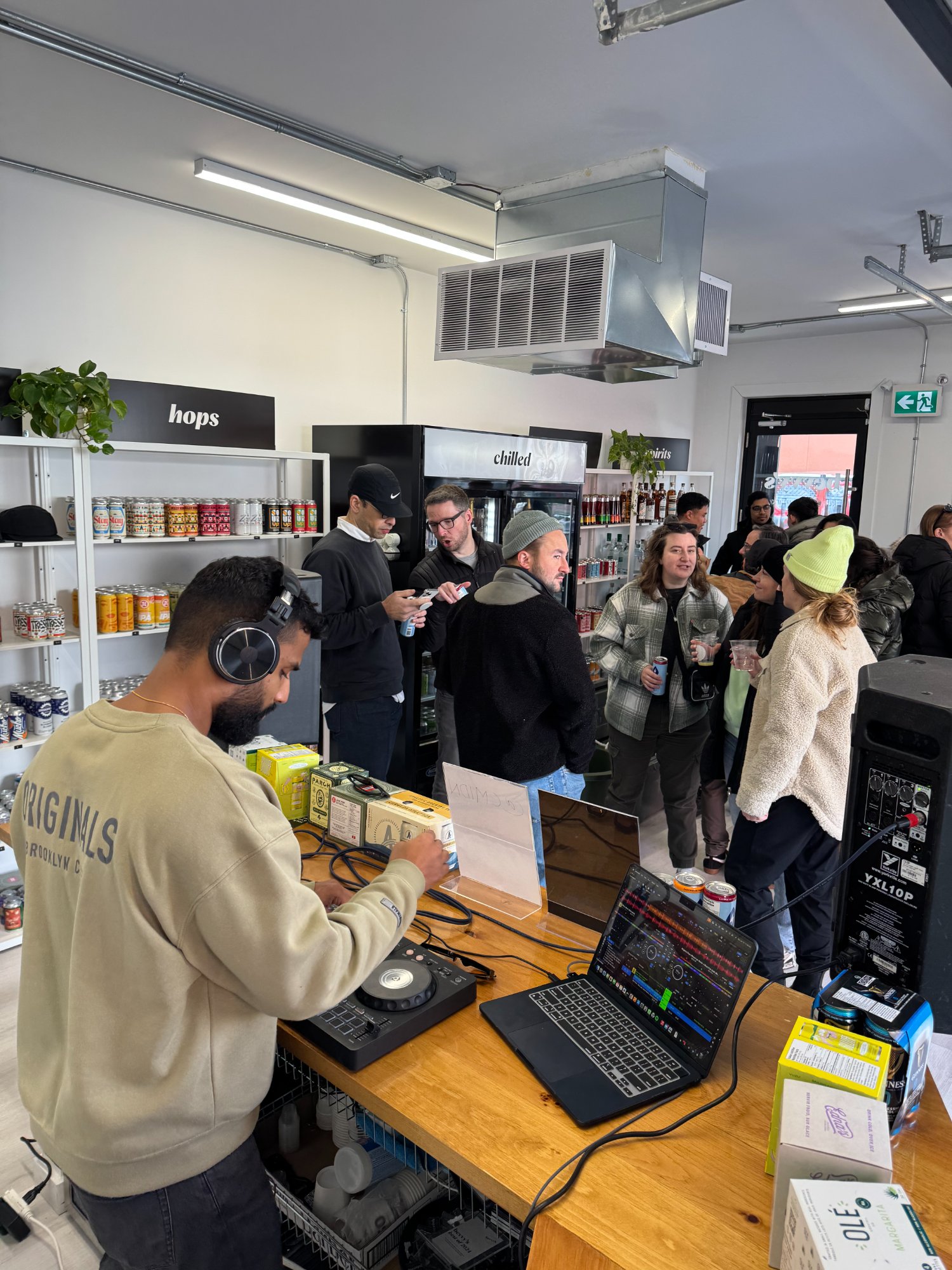 Midhun DJing at a bottle shop event